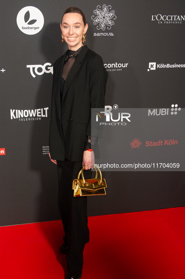 Antonia Bergman, a German actress, poses on the red carpet before the closing award ceremony of the Cologne Film Festival 2024 at E-Werk in...