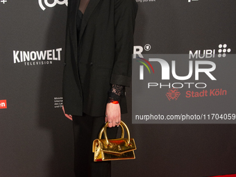 Antonia Bergman, a German actress, poses on the red carpet before the closing award ceremony of the Cologne Film Festival 2024 at E-Werk in...