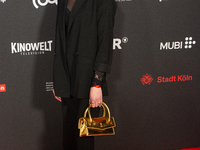 Antonia Bergman, a German actress, poses on the red carpet before the closing award ceremony of the Cologne Film Festival 2024 at E-Werk in...