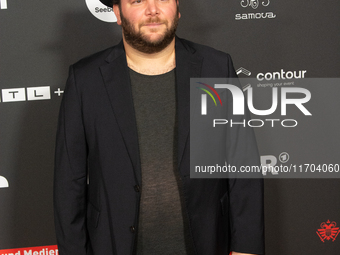 Marshall, a German actor, poses on the red carpet before the closing award ceremony of the Cologne Film Festival 2024 at E-Werk in Cologne,...