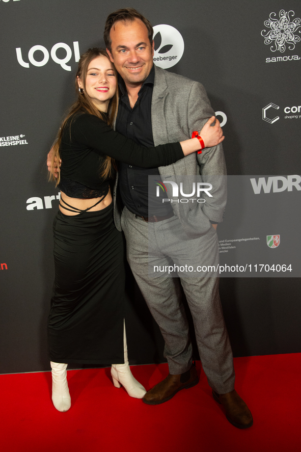 Thomas Becker, the head of program director of Phoenix, and Smilla Felgner, a German actress, pose on the red carpet at E-werk in Cologne, G...