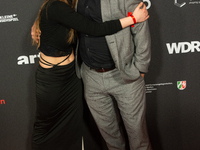 Thomas Becker, the head of program director of Phoenix, and Smilla Felgner, a German actress, pose on the red carpet at E-werk in Cologne, G...