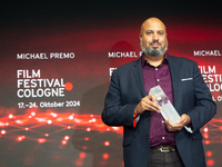 Michael Premo, a US filmmaker, receives the Phoenix Award during the closing award ceremony of the Cologne Film Festival 2024 at E-Werk in C...