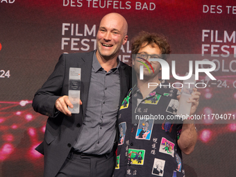 Sascha Verhey and Severin Fiala receive the NRW film prize award during the closing award ceremony of the Cologne Film Festival 2024 at E-We...