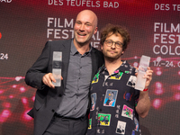 Sascha Verhey and Severin Fiala receive the NRW film prize award during the closing award ceremony of the Cologne Film Festival 2024 at E-We...