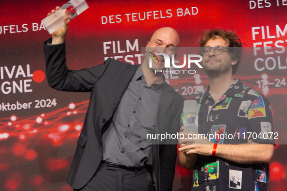 Sascha Verhey and Severin Fiala receive the NRW Film Prize Award during the closing award ceremony of the Cologne Film Festival 2024 at E-We...