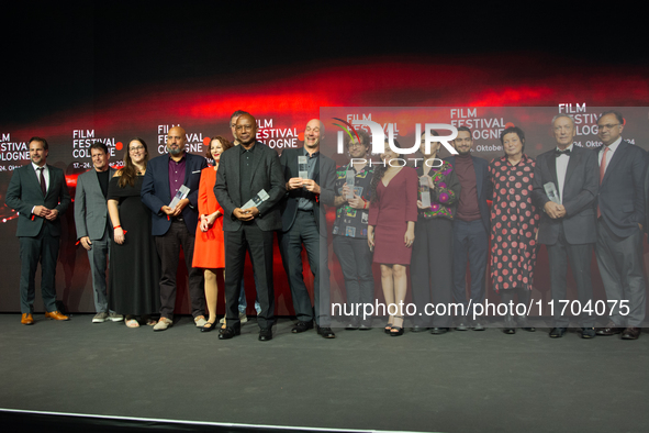 All the award winners take group pictures during the closing award ceremony of the Cologne Film Festival 2024 at E-Werk in Cologne, Germany,...