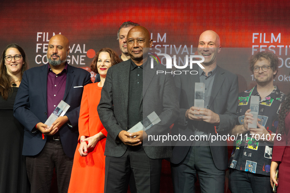 All the award winners take group pictures during the closing award ceremony of the Cologne Film Festival 2024 at E-Werk in Cologne, Germany,...