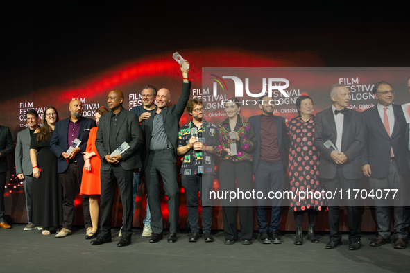 All the award winners take group pictures during the closing award ceremony of the Cologne Film Festival 2024 at E-Werk in Cologne, Germany,...