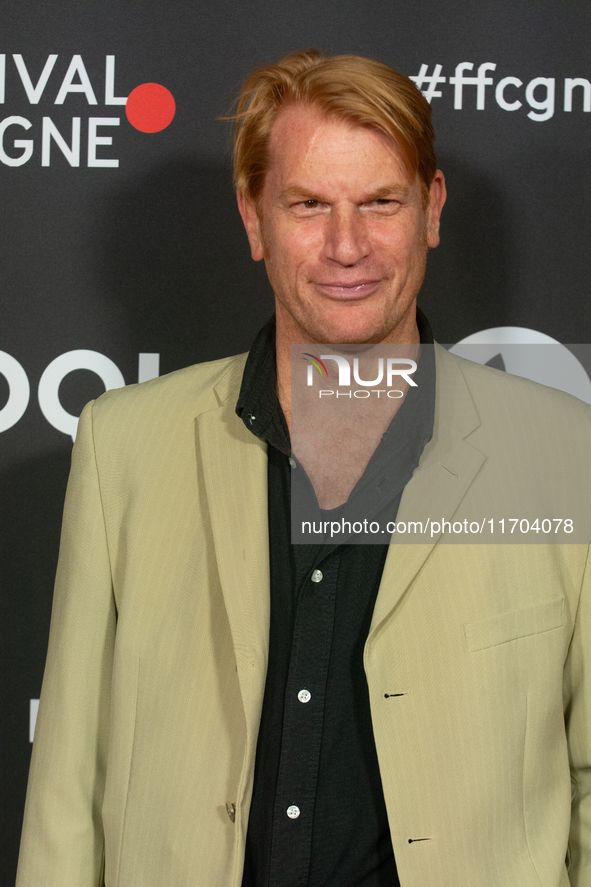 Enno Kalisch, a German actor, poses on the red carpet before the closing award ceremony of the Cologne Film Festival 2024 at E-Werk in Colog...