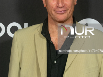 Enno Kalisch, a German actor, poses on the red carpet before the closing award ceremony of the Cologne Film Festival 2024 at E-Werk in Colog...