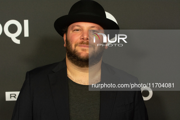 Marshall, a German actor, poses on the red carpet before the closing award ceremony of the Cologne Film Festival 2024 at E-Werk in Cologne,...