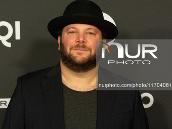 Marshall, a German actor, poses on the red carpet before the closing award ceremony of the Cologne Film Festival 2024 at E-Werk in Cologne,...