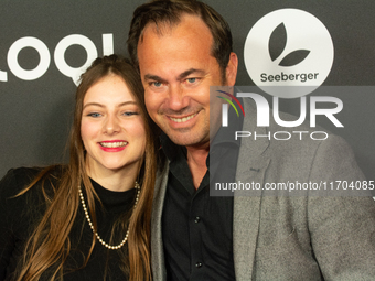 Thomas Becker, the head of program director of Phoenix, and Smilla Felgner, a German actress, pose on the red carpet at E-werk in Cologne, G...