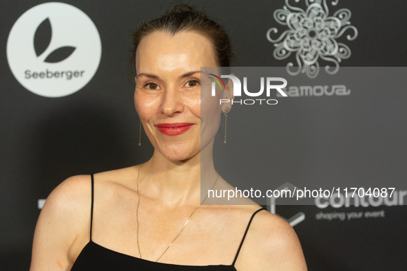 Antonia Bergman, a German actress, poses on the red carpet before the closing award ceremony of the Cologne Film Festival 2024 at E-Werk in...