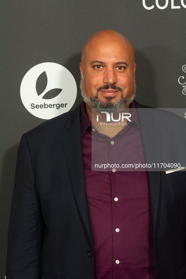 Michael Premo, a US filmmaker, poses on the red carpet before the closing award ceremony of the Cologne Film Festival 2024 at E-Werk in Colo...