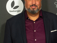 Michael Premo, a US filmmaker, poses on the red carpet before the closing award ceremony of the Cologne Film Festival 2024 at E-Werk in Colo...