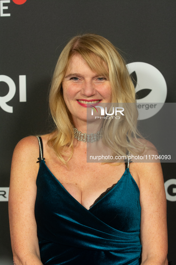 Corinna Nilson, a German actress, poses on the red carpet before the closing award ceremony of the Cologne Film Festival 2024 at E-Werk in C...