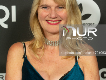 Corinna Nilson, a German actress, poses on the red carpet before the closing award ceremony of the Cologne Film Festival 2024 at E-Werk in C...