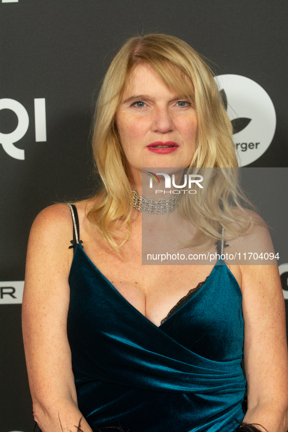 Corinna Nilson, a German actress, poses on the red carpet before the closing award ceremony of the Cologne Film Festival 2024 at E-Werk in C...