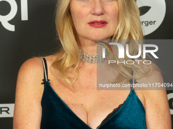 Corinna Nilson, a German actress, poses on the red carpet before the closing award ceremony of the Cologne Film Festival 2024 at E-Werk in C...