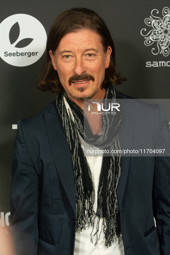 Dean BayKkan, a German actor, poses on the red carpet before the closing award ceremony of the Cologne Film Festival 2024 at E-Werk in Colog...