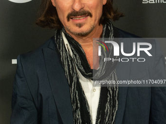 Dean BayKkan, a German actor, poses on the red carpet before the closing award ceremony of the Cologne Film Festival 2024 at E-Werk in Colog...