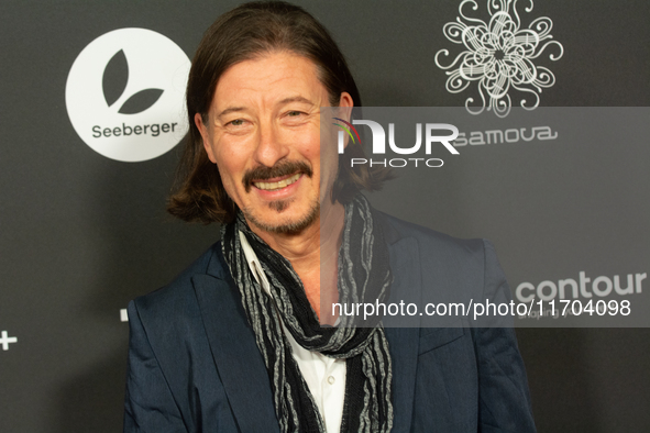 Dean BayKkan, a German actor, poses on the red carpet before the closing award ceremony of the Cologne Film Festival 2024 at E-Werk in Colog...