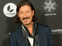 Dean BayKkan, a German actor, poses on the red carpet before the closing award ceremony of the Cologne Film Festival 2024 at E-Werk in Colog...