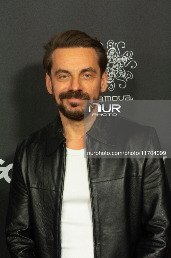 Romano Brusa, a German actor, poses on the red carpet before the closing award ceremony of the Cologne Film Festival 2024 at E-Werk in Colog...