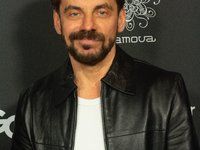 Romano Brusa, a German actor, poses on the red carpet before the closing award ceremony of the Cologne Film Festival 2024 at E-Werk in Colog...