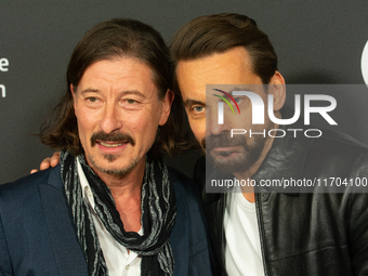 Dean BayKkan, a German actor, and Romano Brusa, a German actor, pose on the red carpet before the closing award ceremony of the Cologne Film...