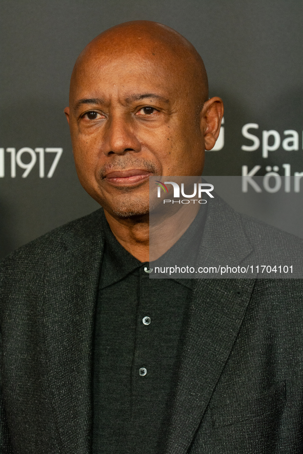 Raoul Peck, a Haitian filmmaker, poses on the red carpet before the closing award ceremony of the Cologne Film Festival 2024 at E-Werk in Co...