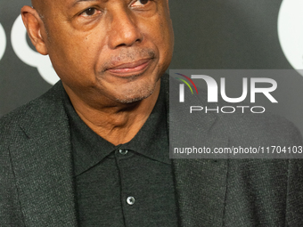 Raoul Peck, a Haitian filmmaker, poses on the red carpet before the closing award ceremony of the Cologne Film Festival 2024 at E-Werk in Co...