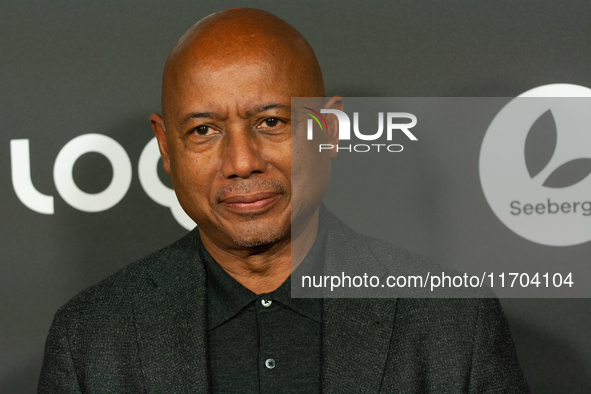 Raoul Peck, a Haitian filmmaker, poses on the red carpet before the closing award ceremony of the Cologne Film Festival 2024 at E-Werk in Co...