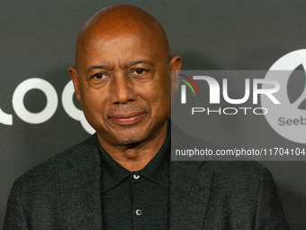 Raoul Peck, a Haitian filmmaker, poses on the red carpet before the closing award ceremony of the Cologne Film Festival 2024 at E-Werk in Co...