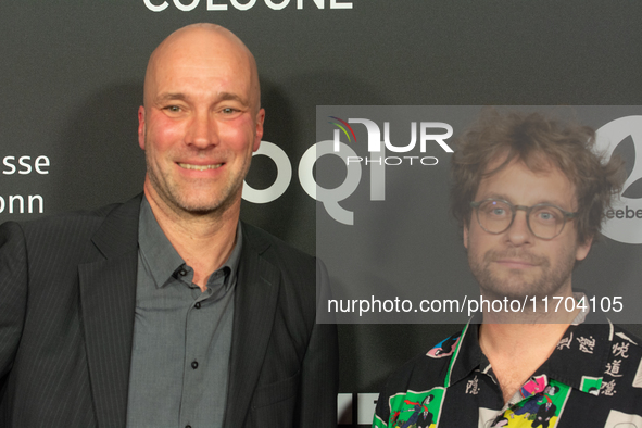 Sascha Verhey and Severin Fiala, a film director, pose on the red carpet before the closing award ceremony of the Cologne Film Festival 2024...