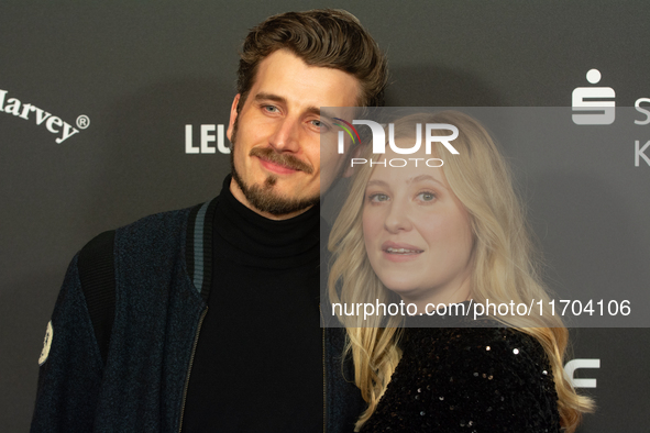 Annina Euling, a German actress, and Michel Kopmann, a German actor, pose on the red carpet before the closing award ceremony of the Cologne...