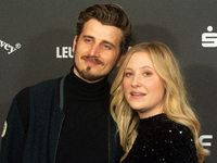 Annina Euling, a German actress, and Michel Kopmann, a German actor, pose on the red carpet before the closing award ceremony of the Cologne...