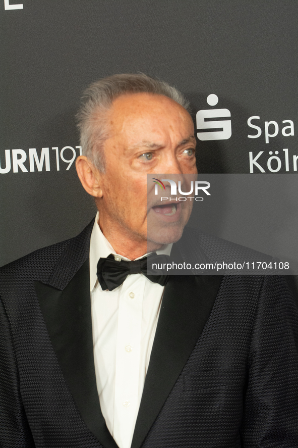 Udo Kier, a German actor, poses on the red carpet before the closing award ceremony of the Cologne Film Festival 2024 at E-Werk in Cologne,...