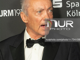 Udo Kier, a German actor, poses on the red carpet before the closing award ceremony of the Cologne Film Festival 2024 at E-Werk in Cologne,...