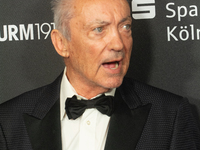 Udo Kier, a German actor, poses on the red carpet before the closing award ceremony of the Cologne Film Festival 2024 at E-Werk in Cologne,...