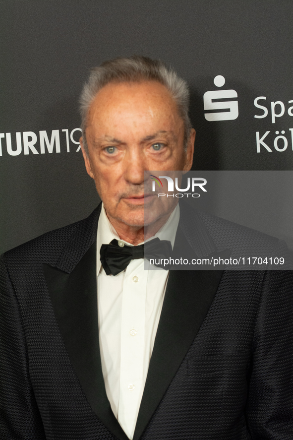 Udo Kier, a German actor, poses on the red carpet before the closing award ceremony of the Cologne Film Festival 2024 at E-Werk in Cologne,...