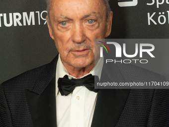 Udo Kier, a German actor, poses on the red carpet before the closing award ceremony of the Cologne Film Festival 2024 at E-Werk in Cologne,...