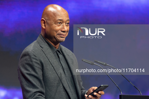 Raoul Peck, a Haitian filmmaker, receives the film prize award during the closing award ceremony of the Cologne Film Festival 2024 at E-Werk...