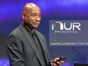 Raoul Peck, a Haitian filmmaker, receives the film prize award during the closing award ceremony of the Cologne Film Festival 2024 at E-Werk...