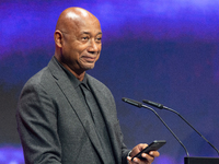 Raoul Peck, a Haitian filmmaker, receives the film prize award during the closing award ceremony of the Cologne Film Festival 2024 at E-Werk...