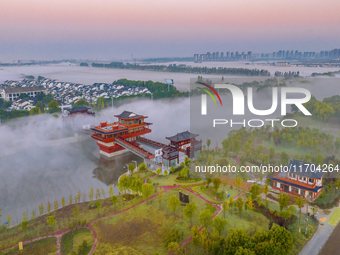 The Wafang Village is seen in the morning mist in Suqian, China, on October 24, 2024. In recent years, in combination with water environment...