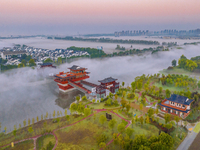 The Wafang Village is seen in the morning mist in Suqian, China, on October 24, 2024. In recent years, in combination with water environment...