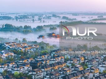 The Wafang Village is seen in the morning mist in Suqian, China, on October 24, 2024. In recent years, in combination with water environment...